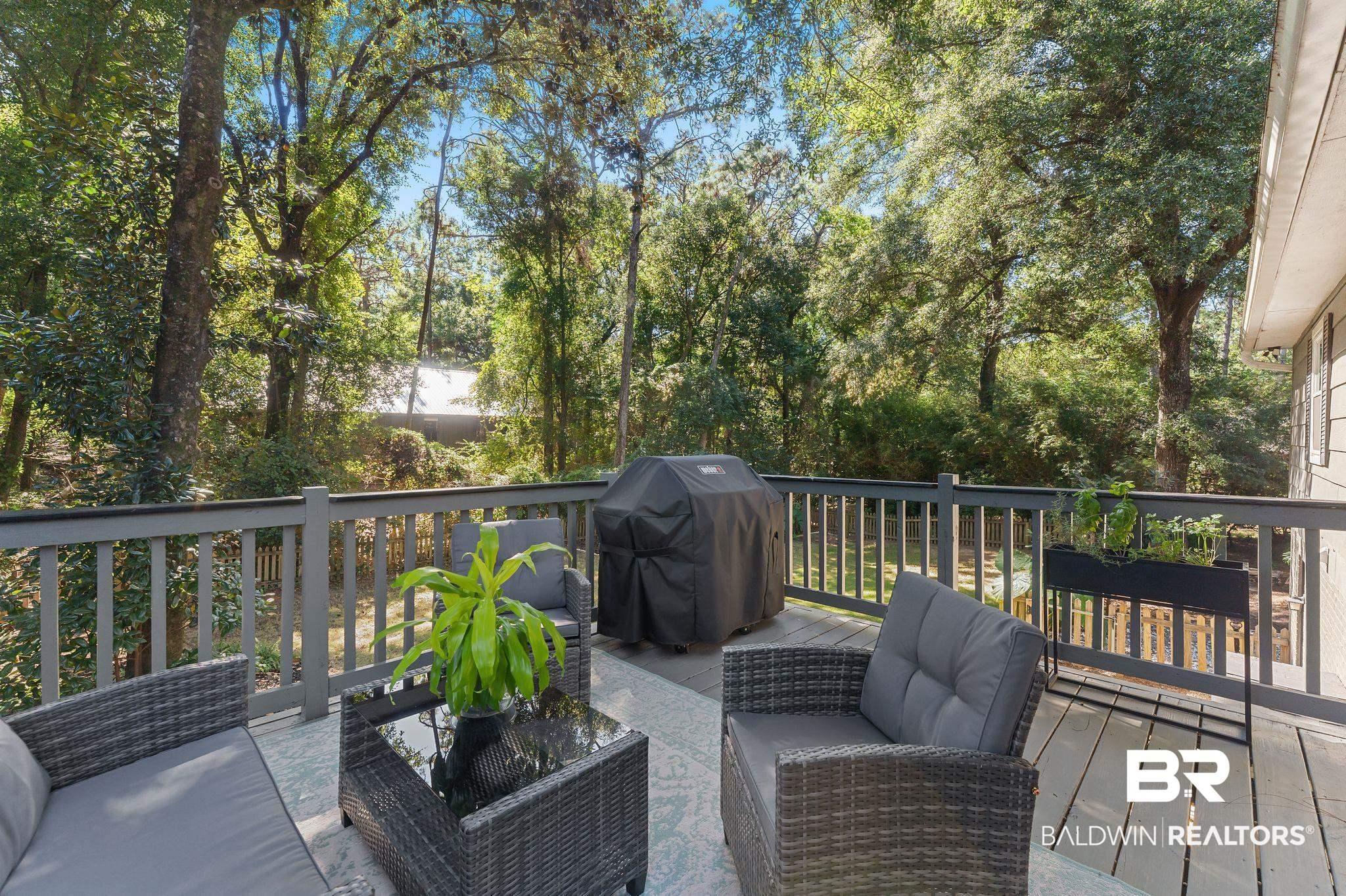 Image 3: Deck Overlooks Private Backyard