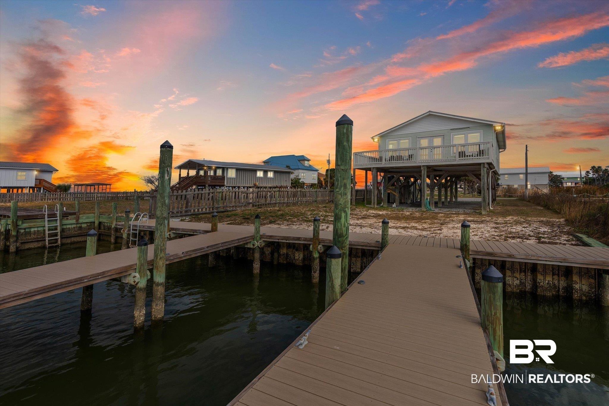 Image 1: Dock featuring a water view