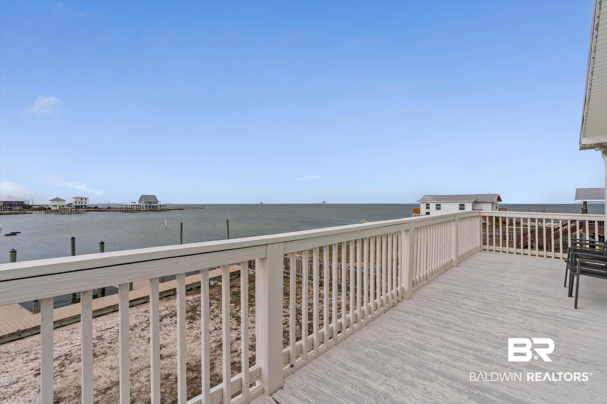 Image 3: Deck featuring a water view