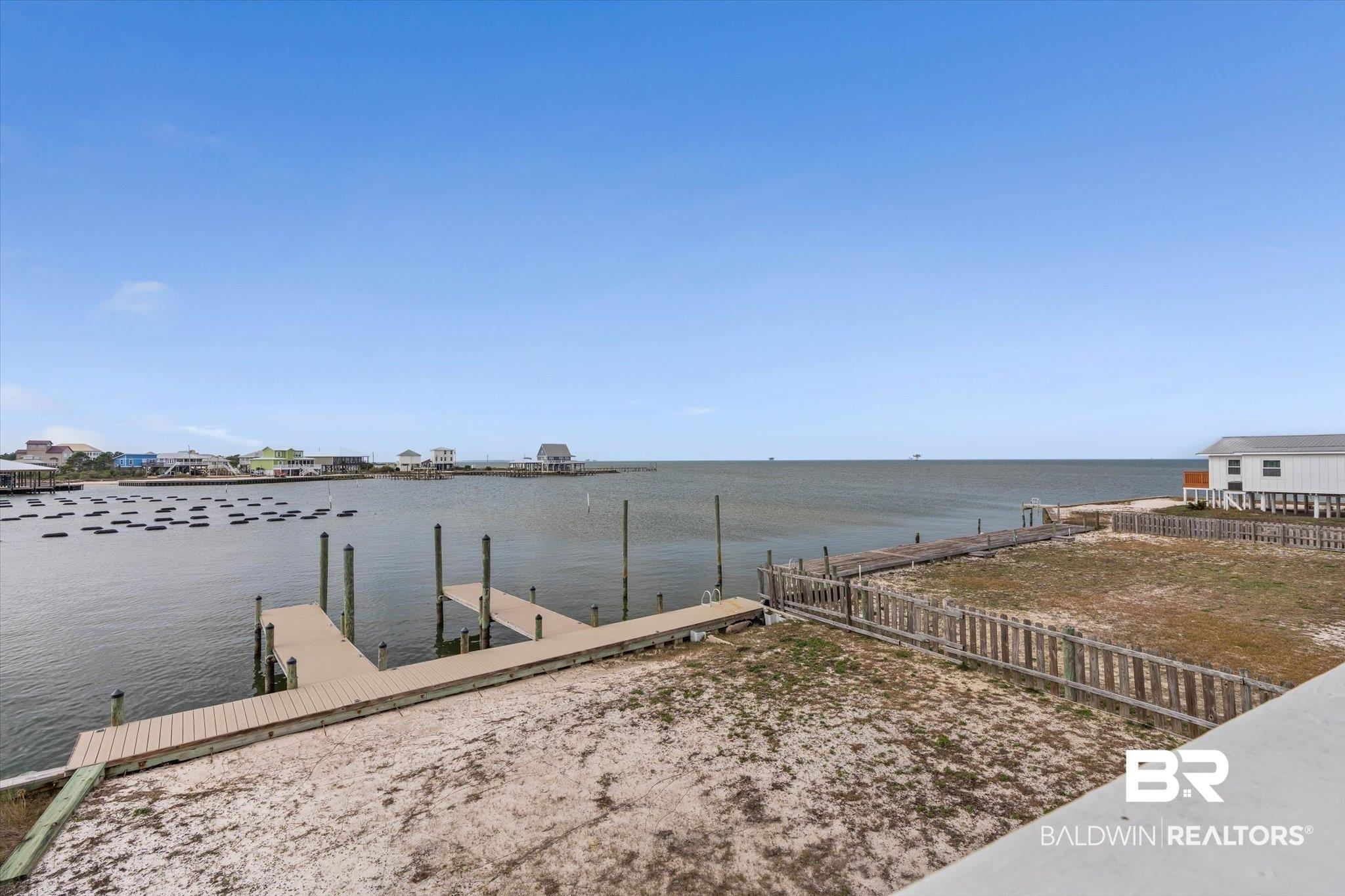Image 4: Dock featuring a water view