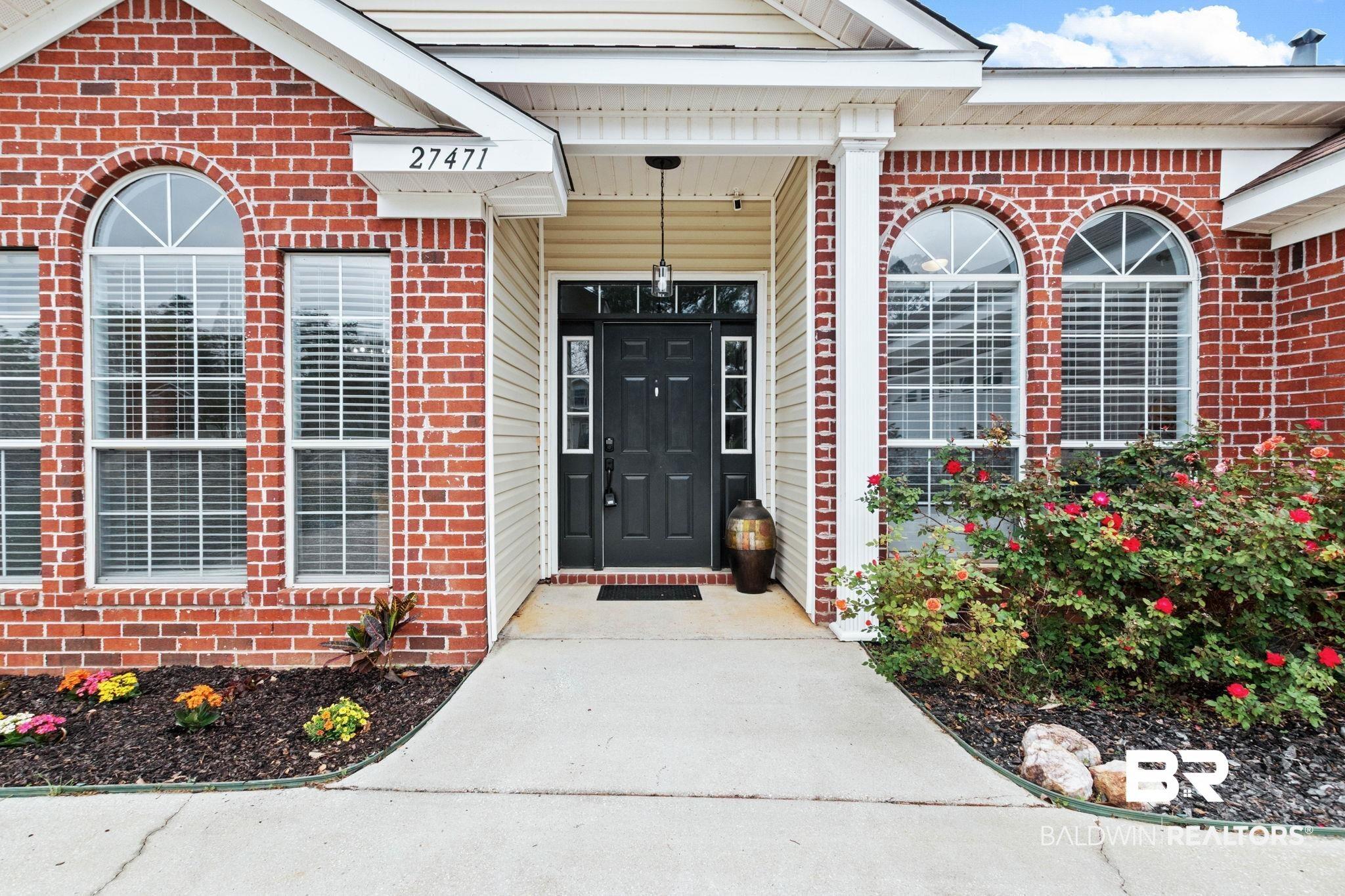 Image 4: Entrance to property with brick siding