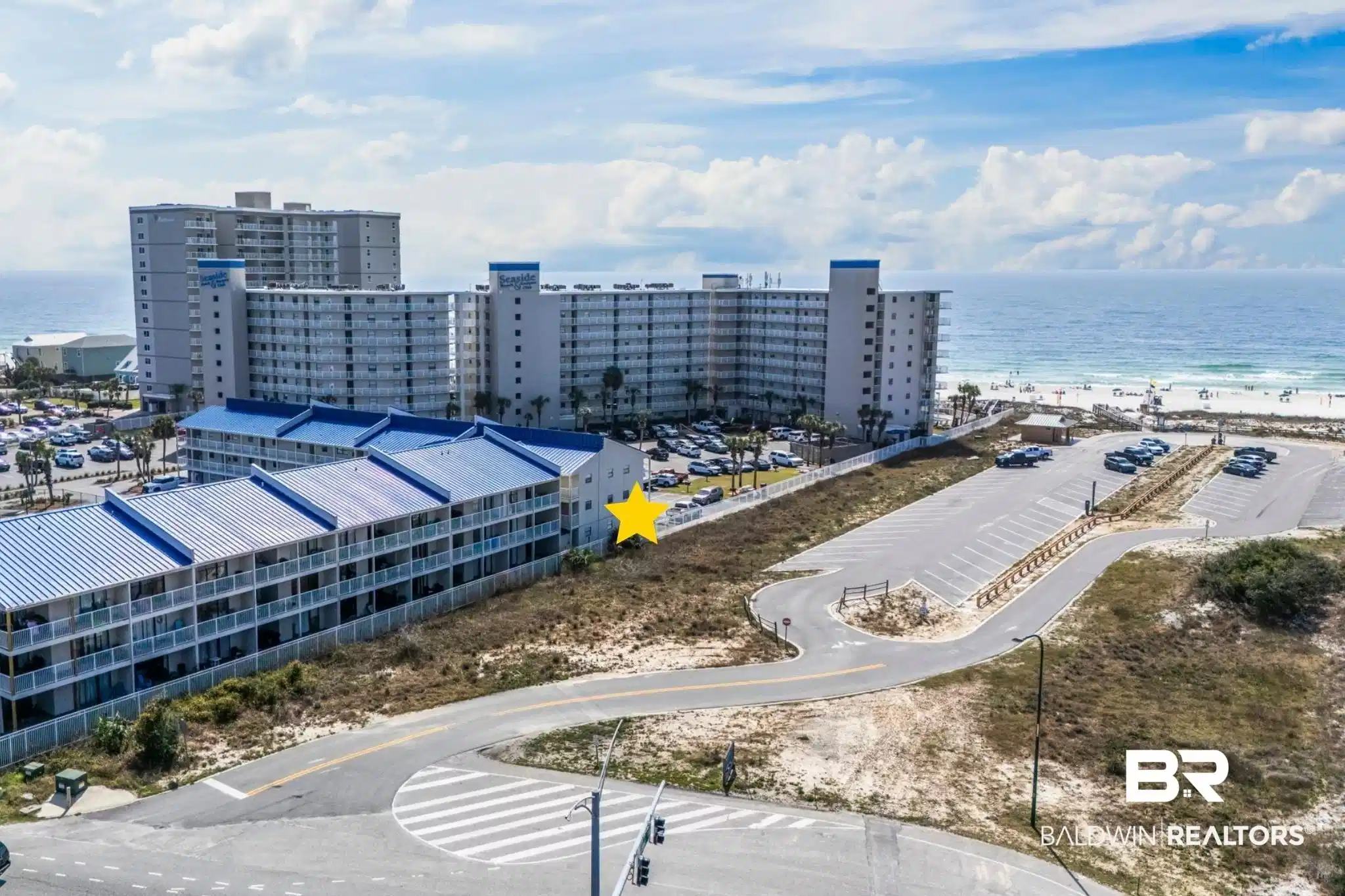 Image 1: Bird's eye view of a nearby body of water and apartment complex