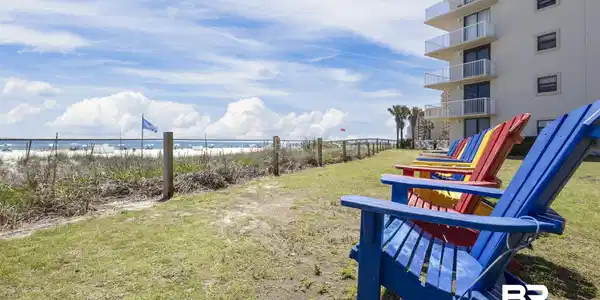 Image 2: View of yard featuring view of water and beach