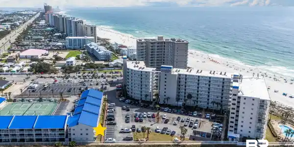 Image 3: View of urban area with expansive coastline and apartment complex / building