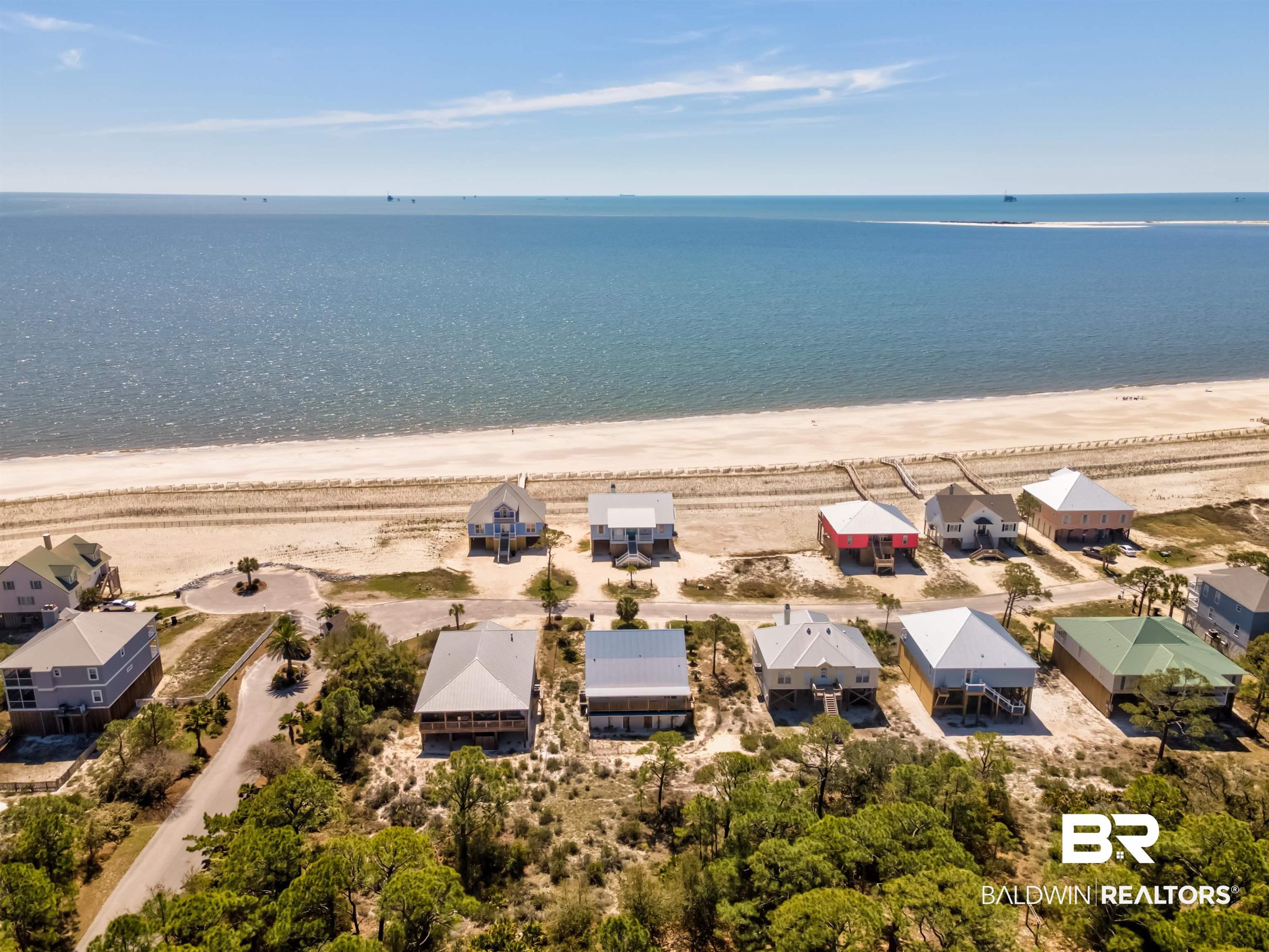 Image 2: Aerial perspective of suburban area featuring expansive coastline