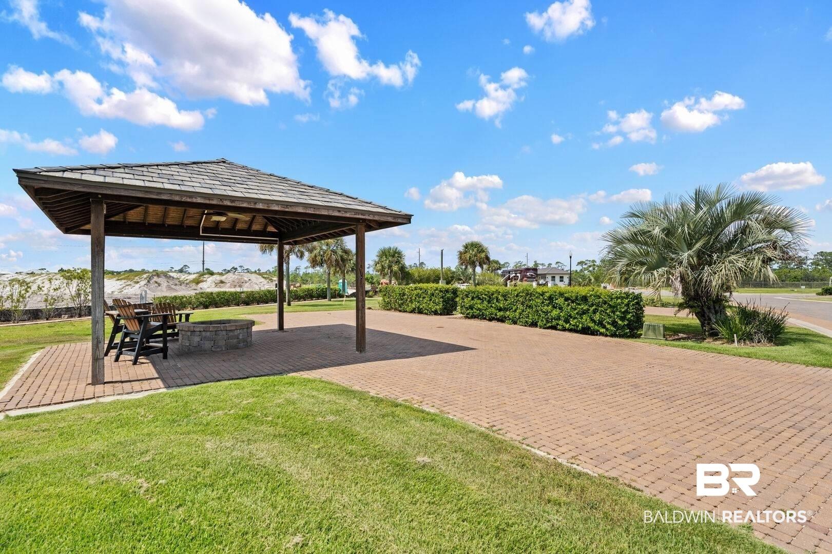 Image 3: View of community featuring a yard, a patio area, and a gazebo