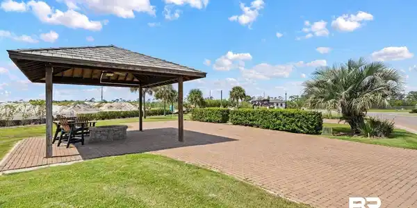 Image 3: View of community featuring a yard, a patio area, and a gazebo