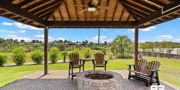 Image 4: View of patio / terrace with ceiling fan and a fire pit