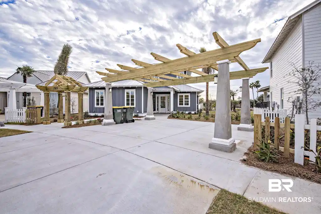 Image 1: View of patio with a pergola