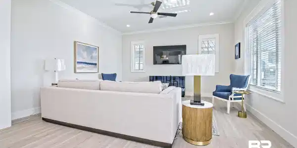 Image 3: Living room with ceiling fan, ornamental molding, a healthy amount of sunlight, and light hardwood / wood-style flooring