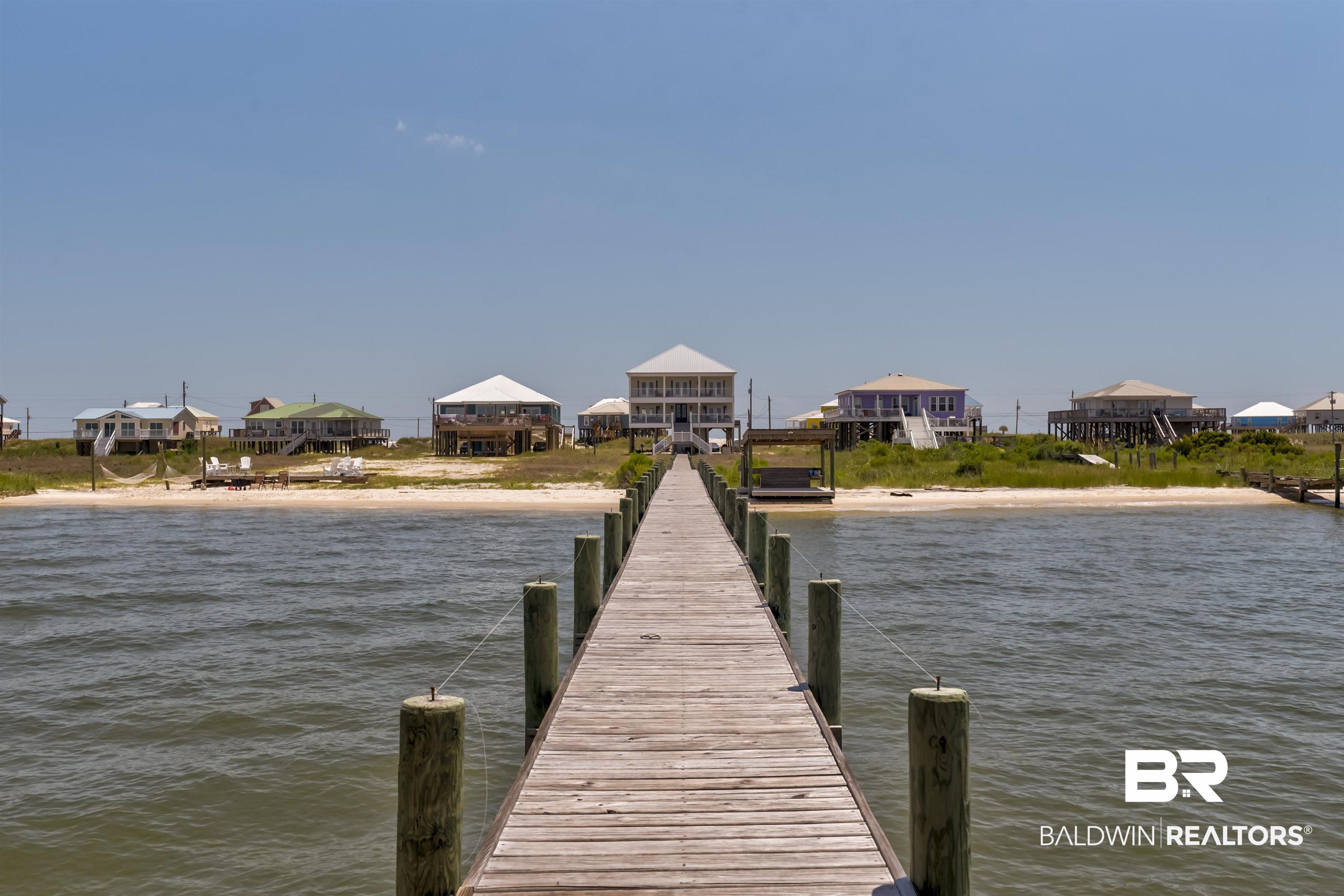 Image 3: Dock area featuring a water view and a residential view