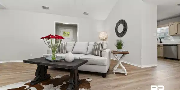 Image 3: Vaulted ceiling living area featuring light wood-finish flooring