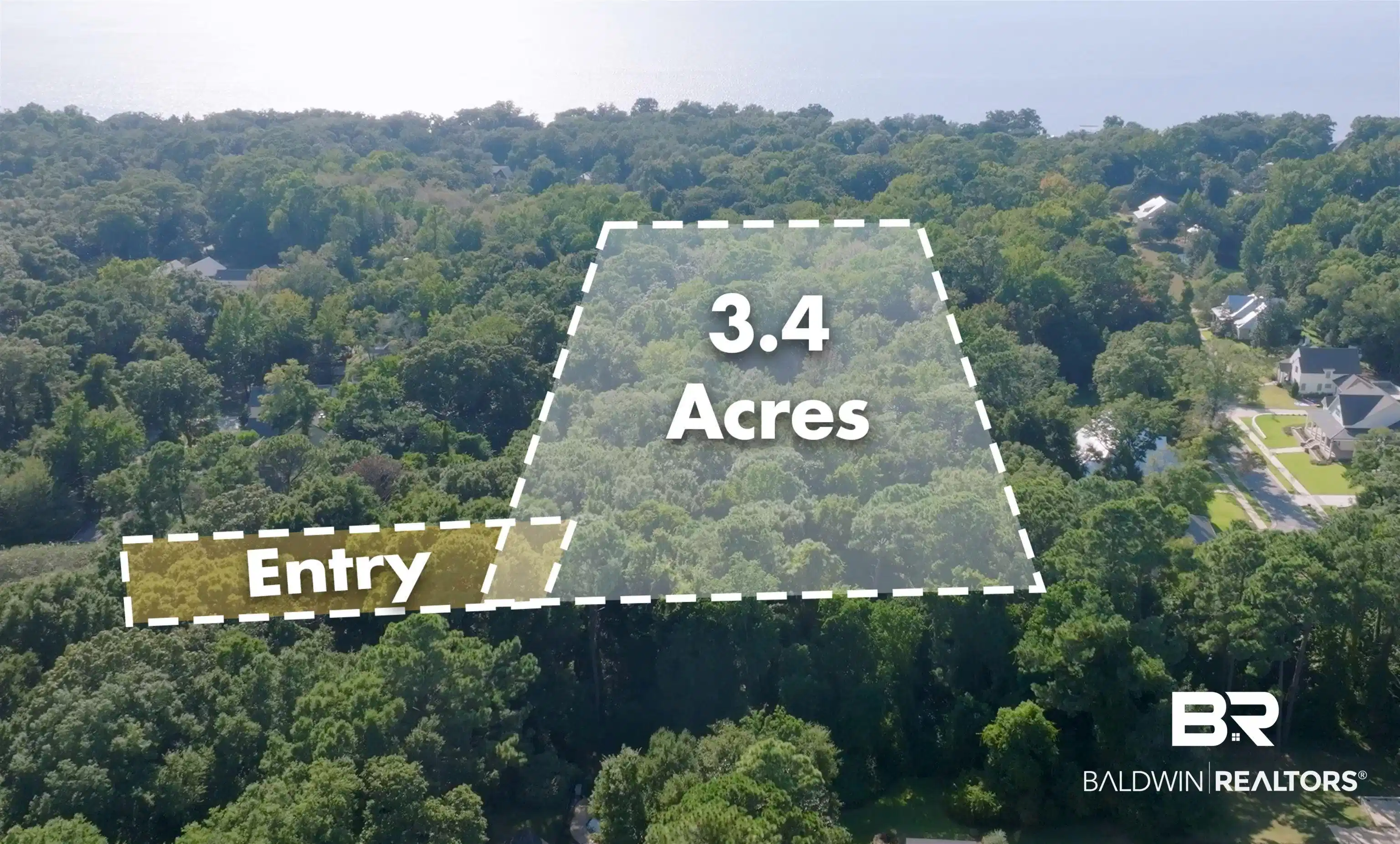 Image 1: Aerial overview of property's location featuring a heavily wooded area and property boundaries highlighted