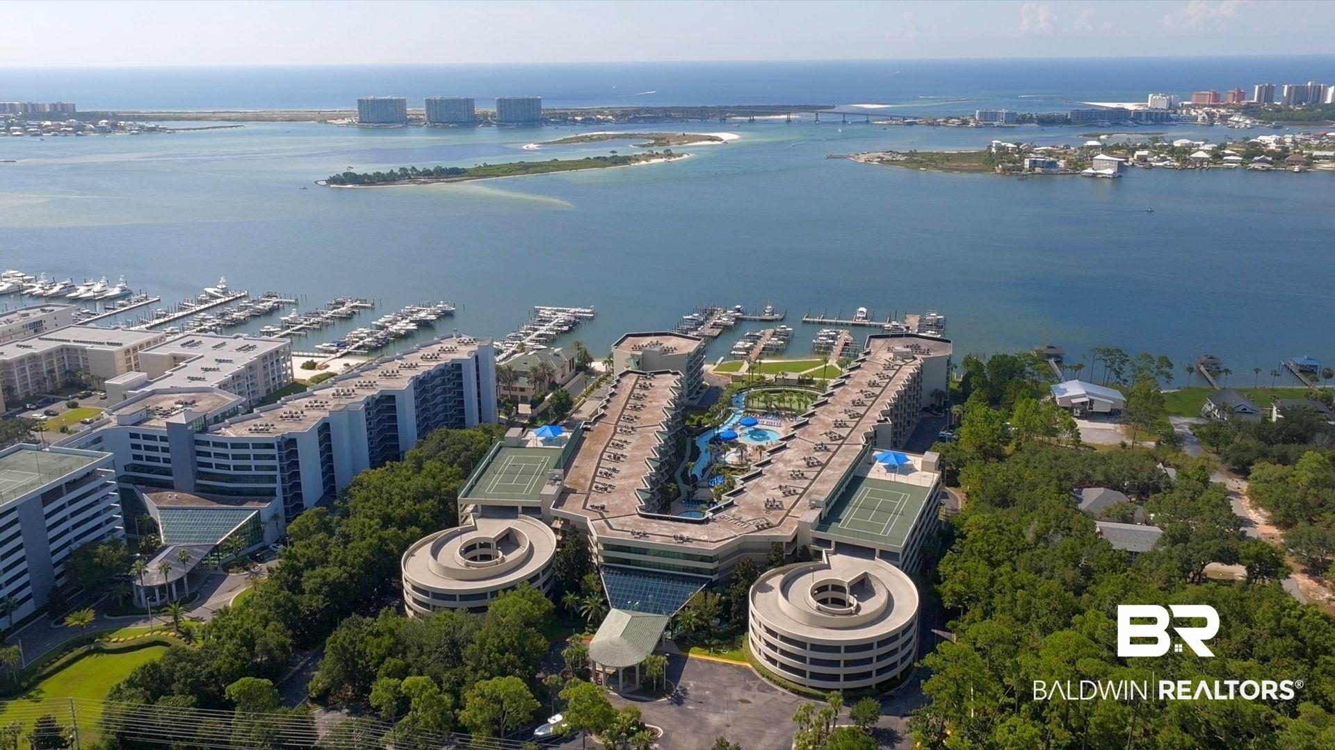 Image 2: View of urban area with a nearby body of water and numerous boat docks