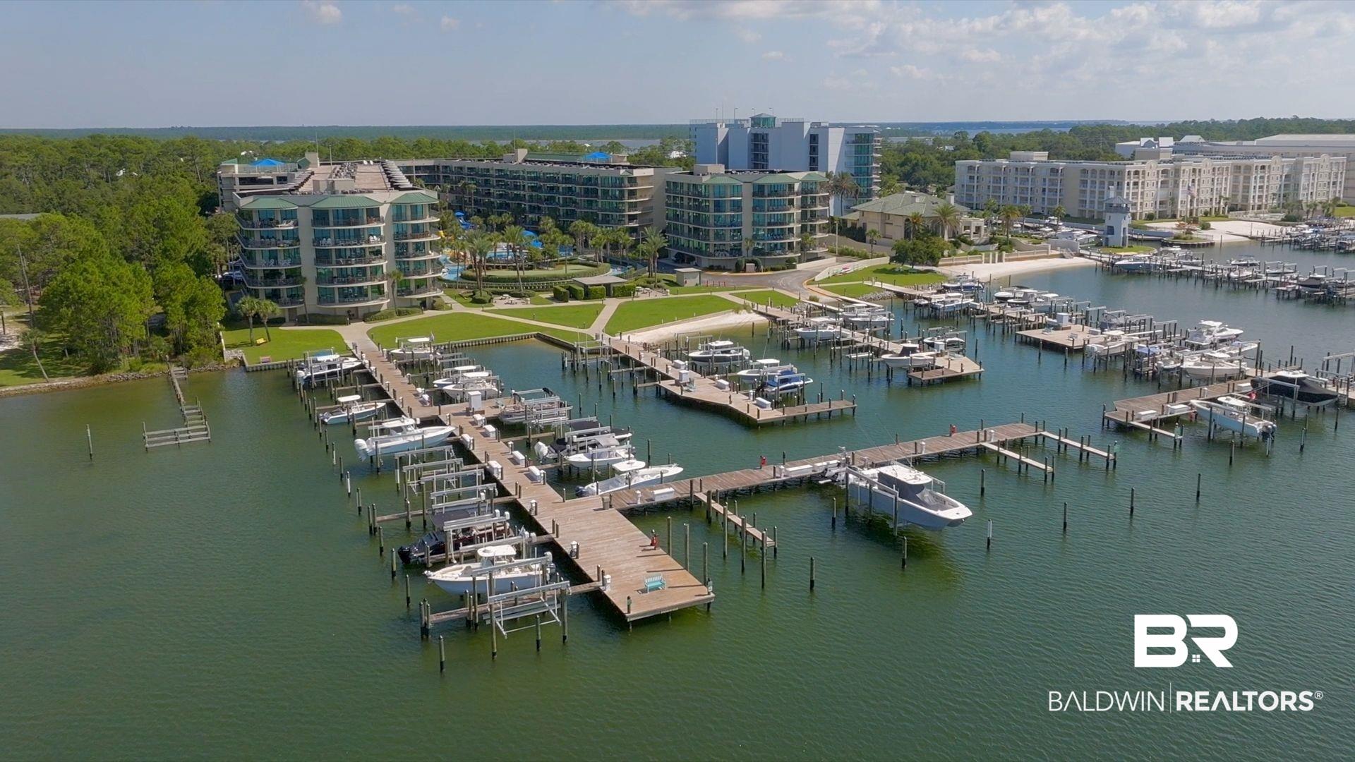 Image 4: Aerial view of numerous boat docks and a large body of water