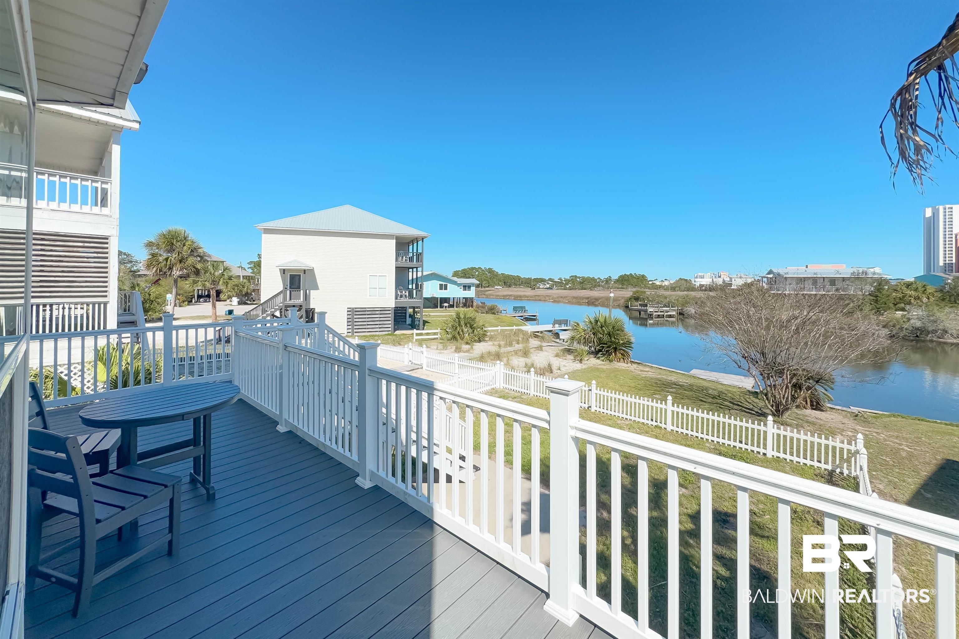 Image 2: Wooden deck with a water view