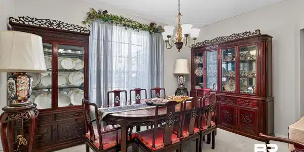 Image 3: Carpeted room featuring a large window with sheer and opaque drapery