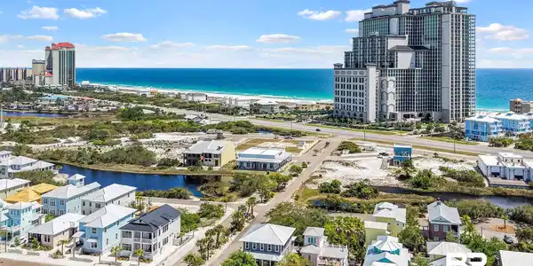 Image 3: Aerial perspective showcasing coastal property and surrounding community