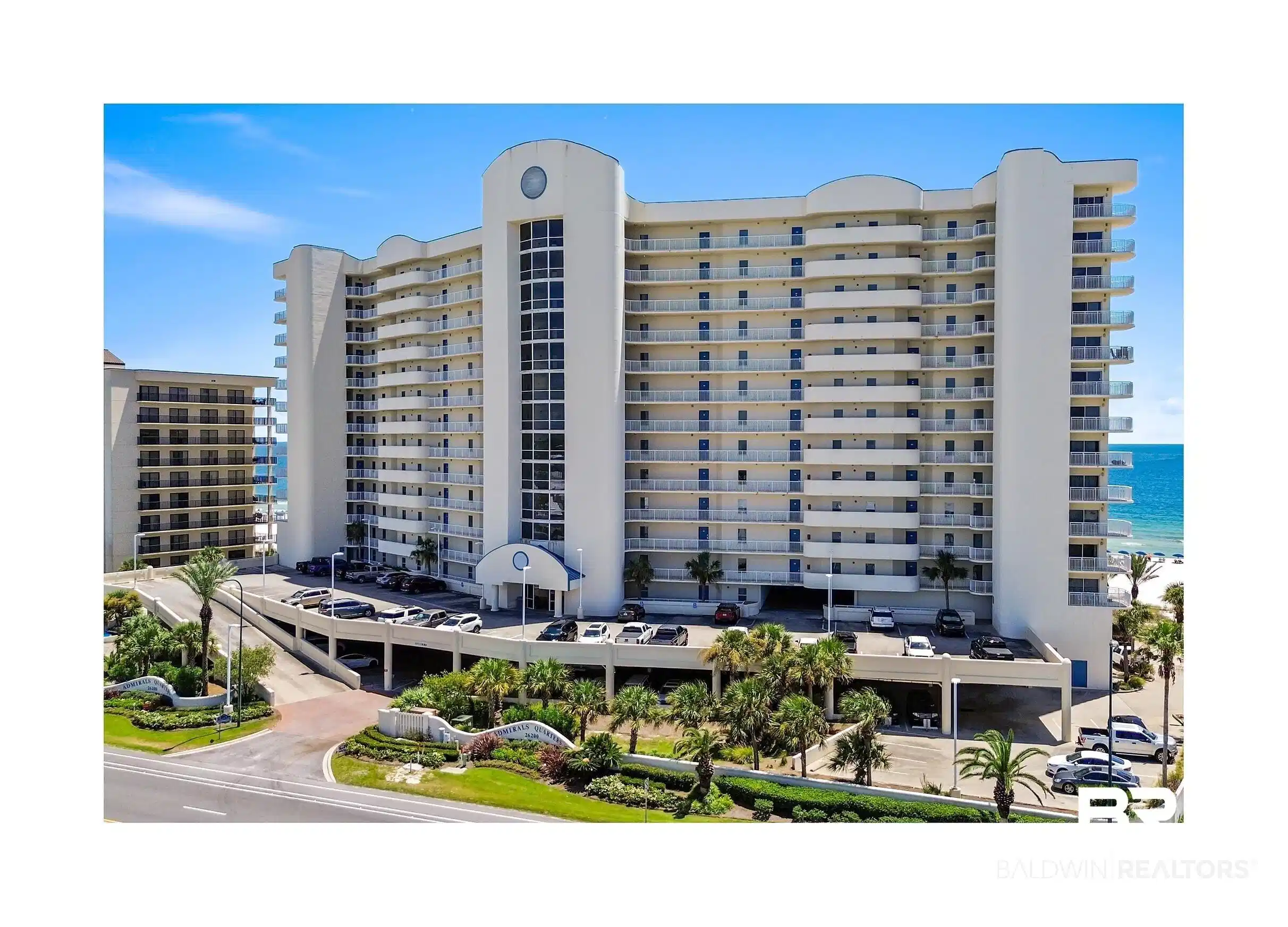 Image 1: View of apartment building / complex featuring a water view