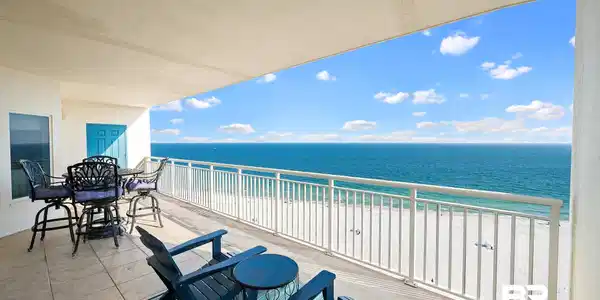 Image 2: Balcony with view of water and beach