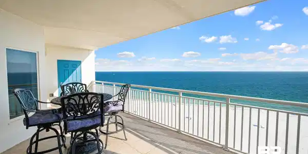 Image 3: Balcony with view of water and beach