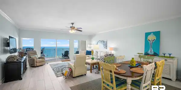 Image 4: Dining space with wood tiled floors, ceiling fan, and ornamental molding
