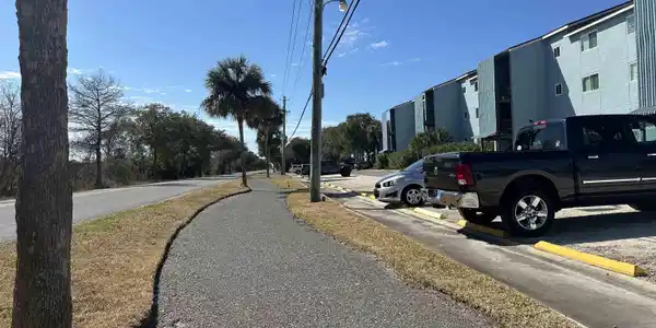 Image 3: View of asphalt street with sidewalks and street lighting