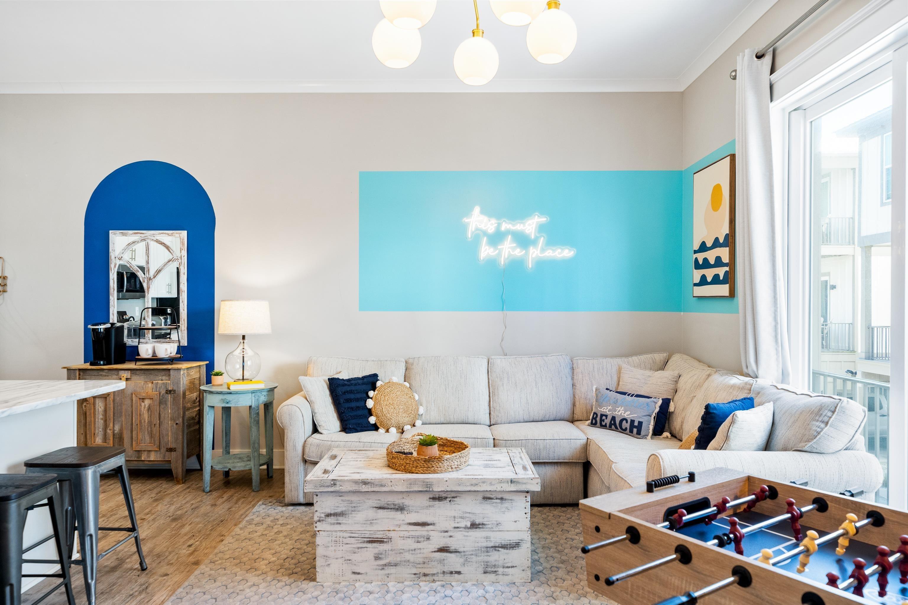 Image 2: Living room with ornamental molding and wood finished floors