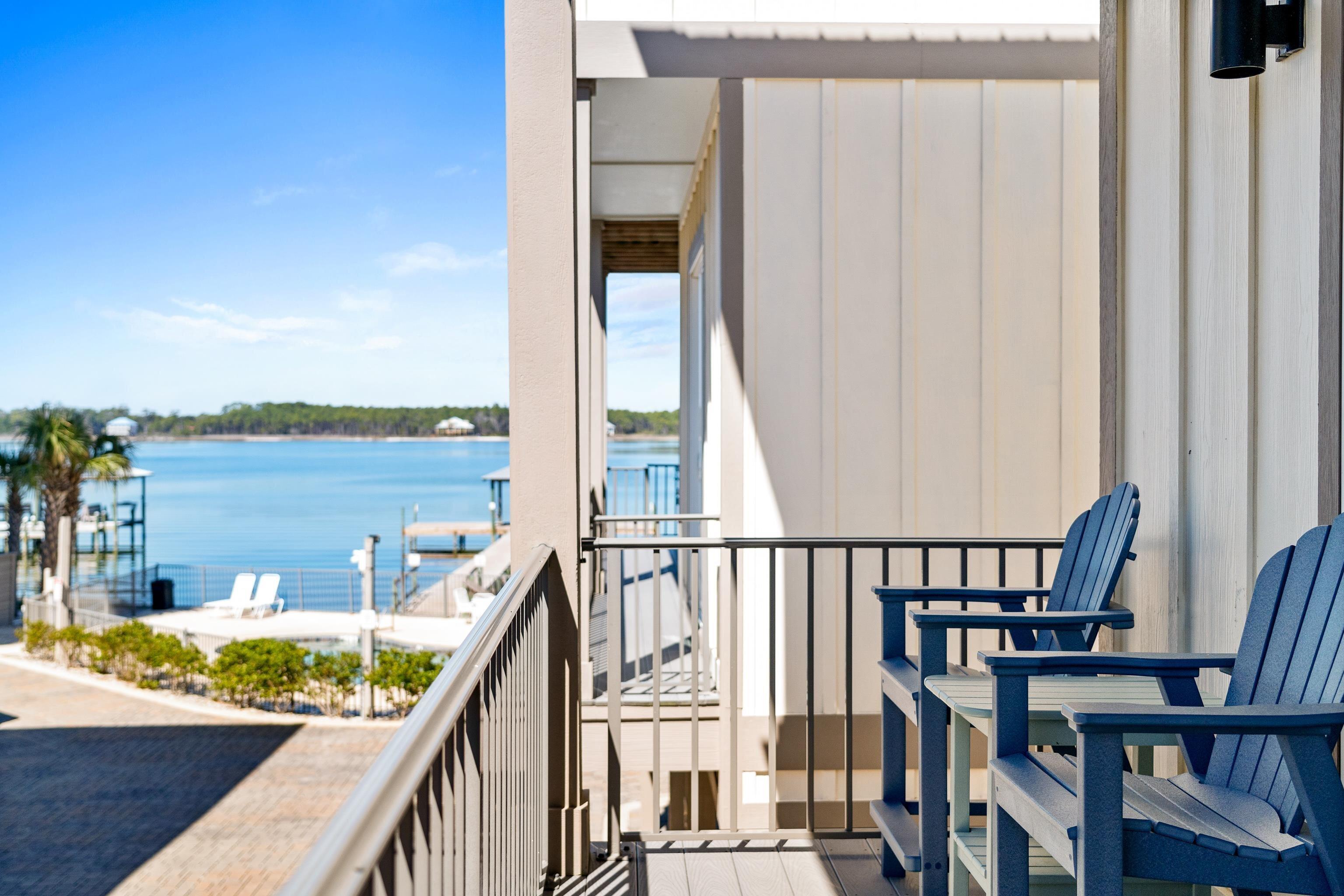Image 4: Balcony featuring a water view