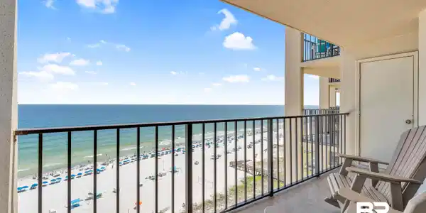 Image 4: Balcony with view of water and beach
