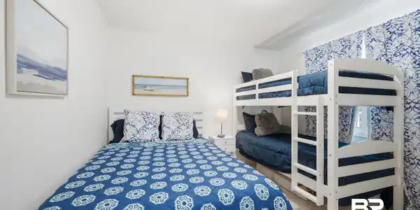Image 3: White-painted walls and light-toned flooring create a bright atmosphere