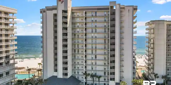 Image 3: View of apartment building / complex with a water view
