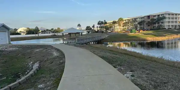 Image 3: Dock area featuring a water view and a yard