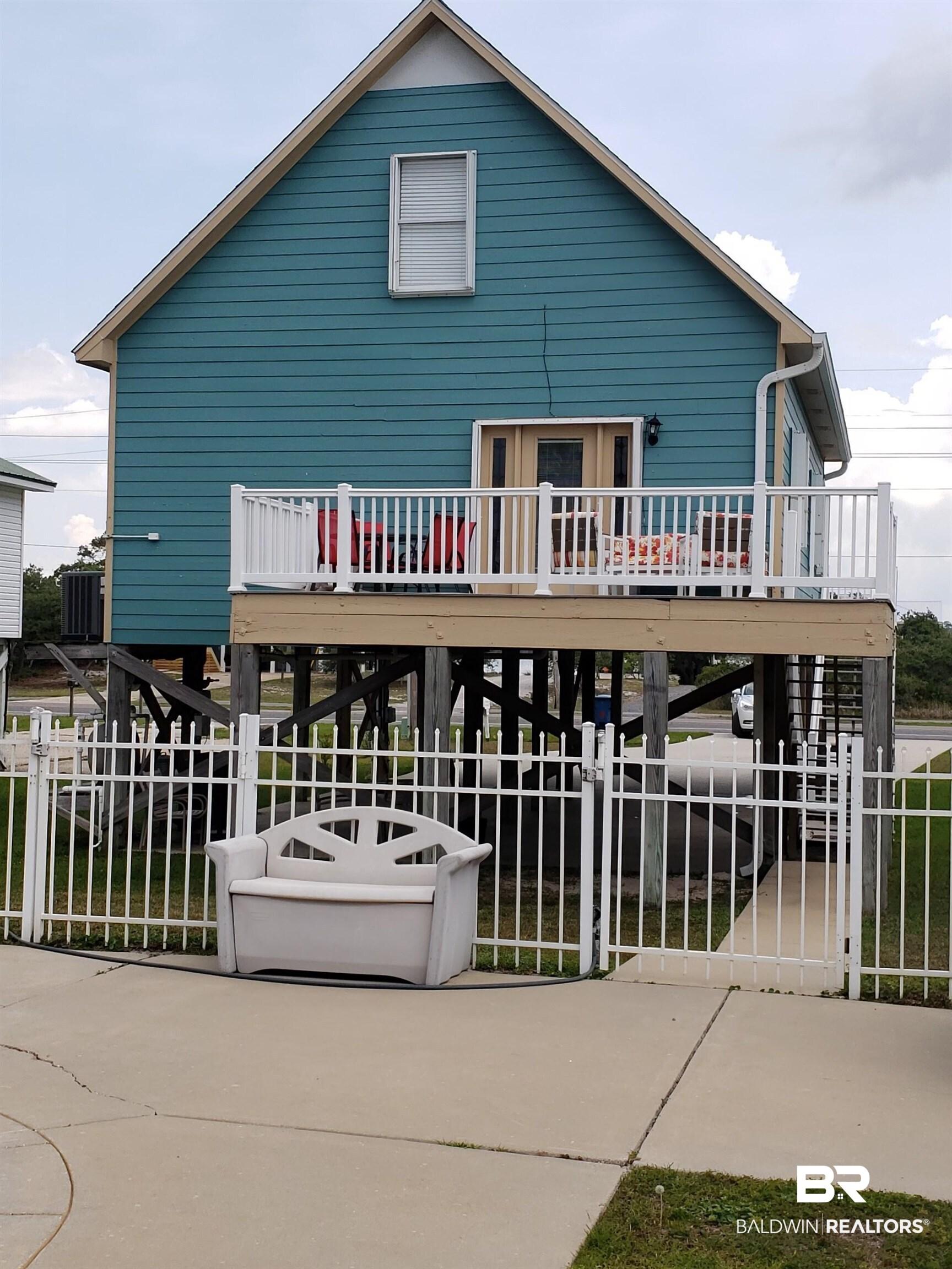 Image 2: Large balcony with access from the primary bedroom overlooking the private pool.