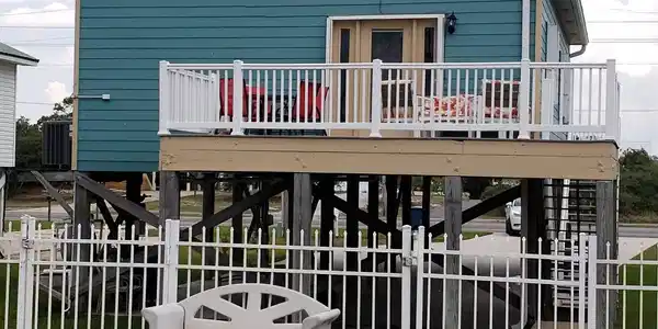 Image 2: Large balcony with access from the primary bedroom overlooking the private pool.