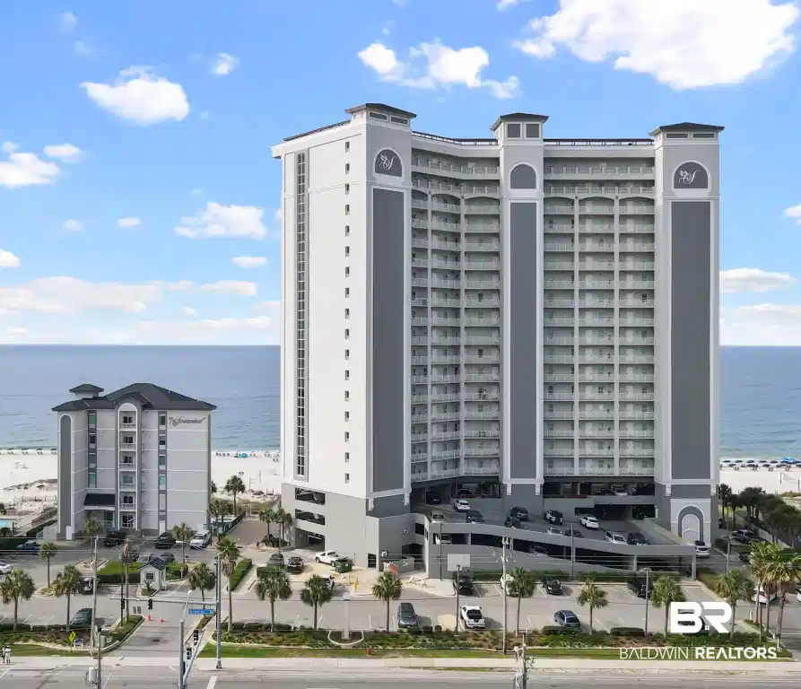Image 1: Contemporary high-rise building featuring multiple balconies and structured parking