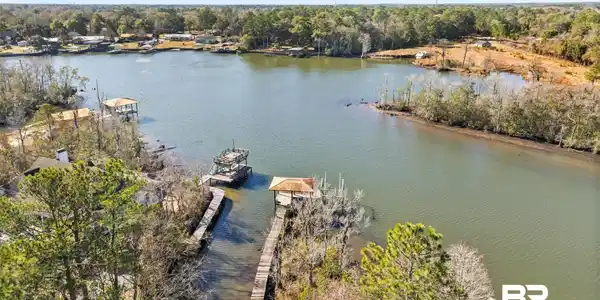 Image 2: Water view with a dock