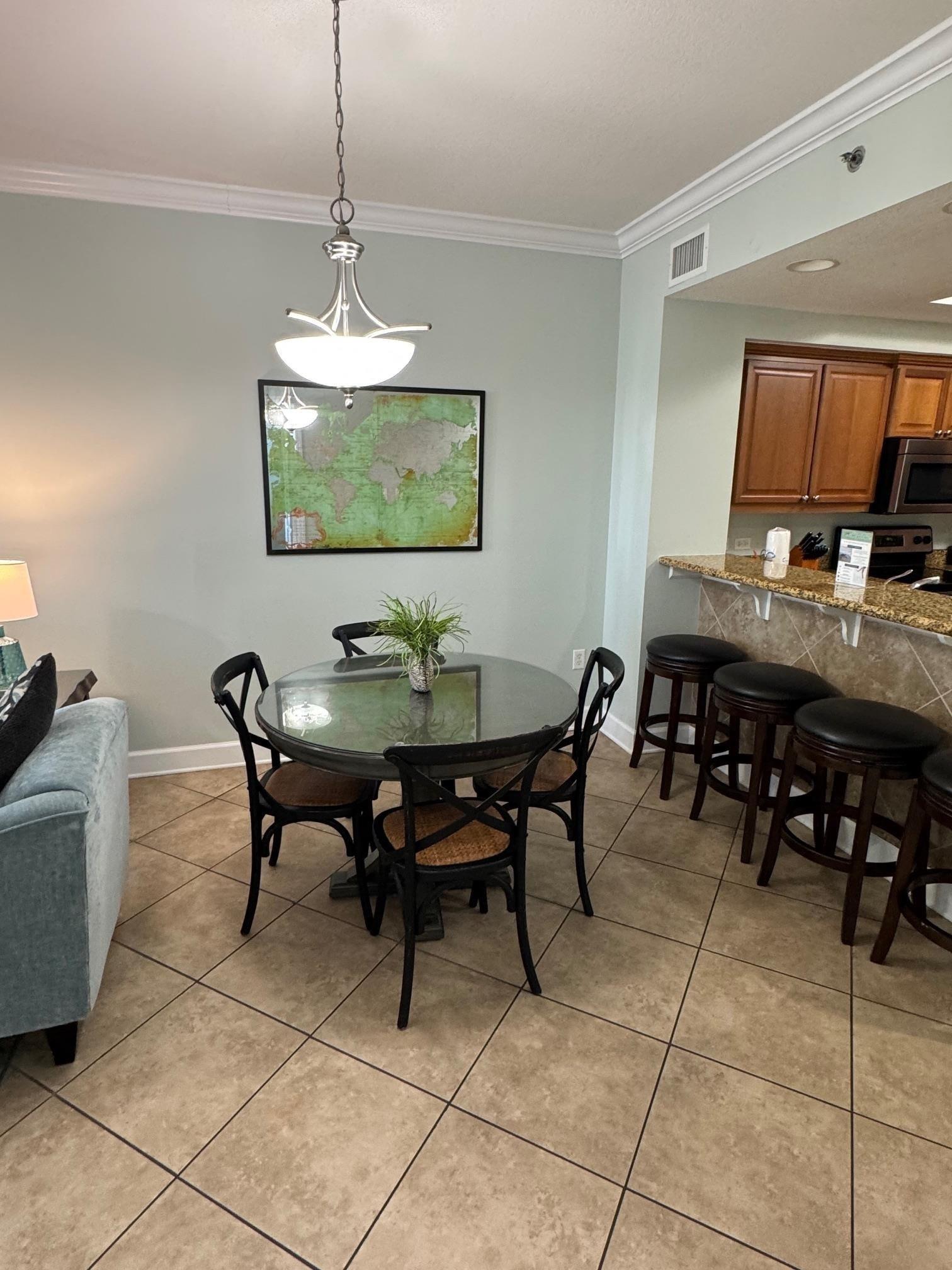 Image 4: Tiled dining space with ornamental molding