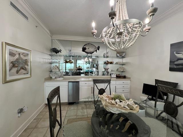 Image 3: Dining area with crown molding, suspended lighting, and light tile patterned floors