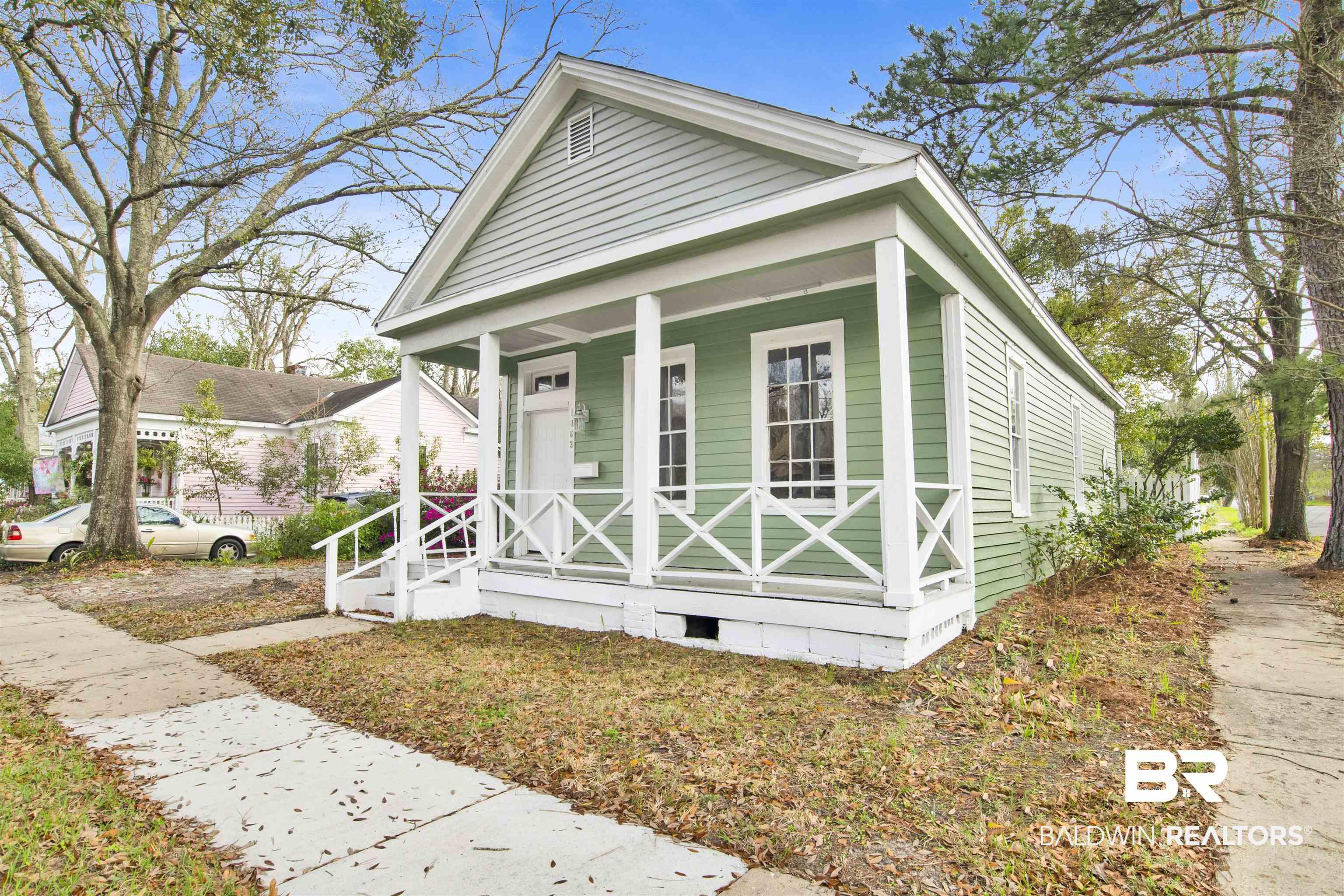 Image 2: Shotgun-style home featuring a porch and crawl space