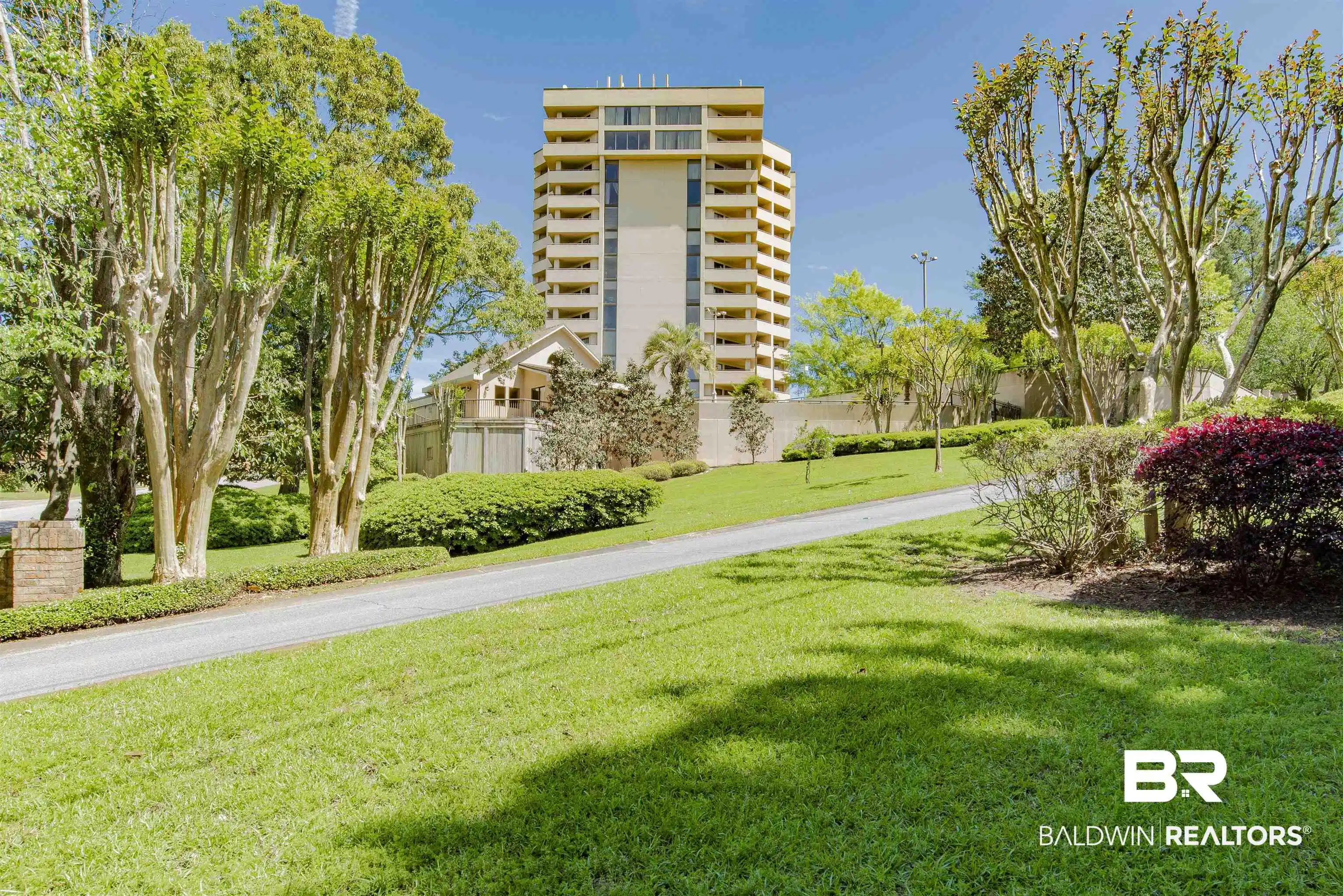 Image 1: Multi-story building featuring numerous balconies