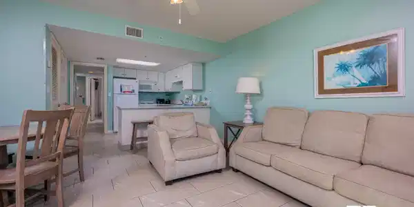 Image 4: Living area with ceiling fan and a textured ceiling
