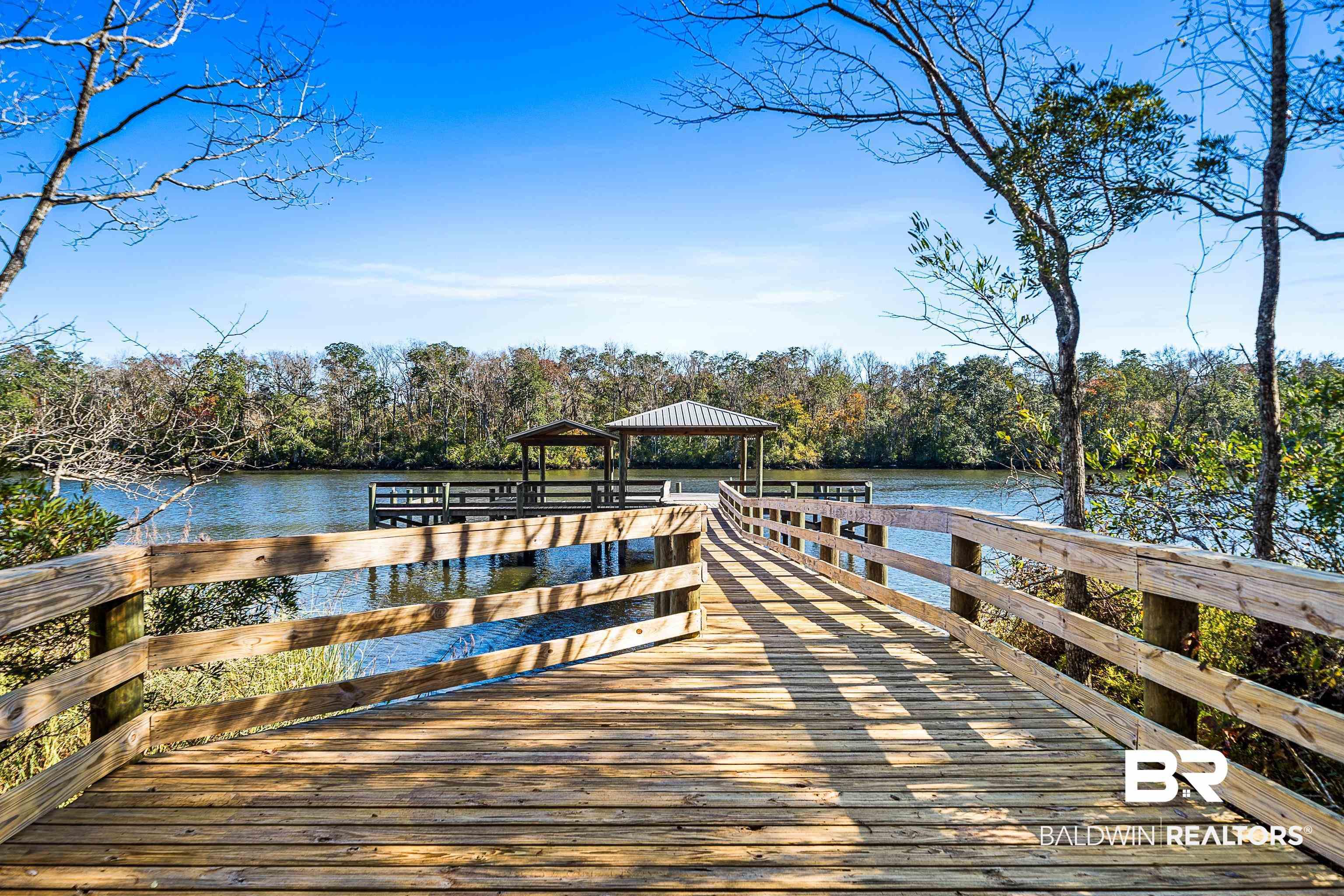 Image 4: Dock area featuring a gazebo and a water view