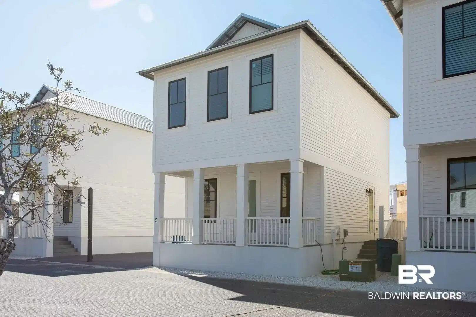 Image 1: View of front of house featuring a porch