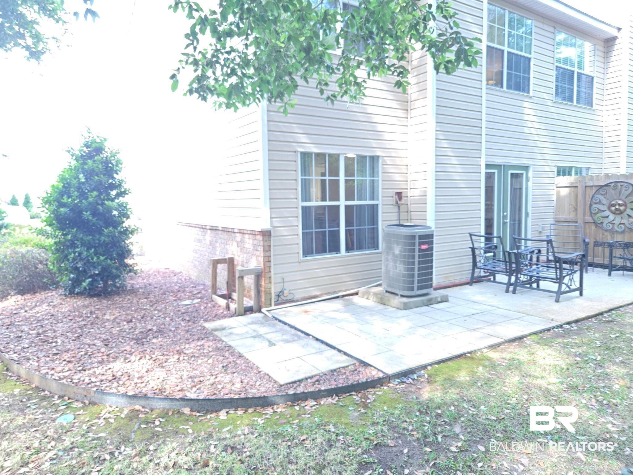 Image 4: Private rear patio with concrete pavers