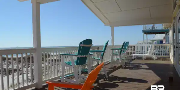 Image 4: Soak up the sun and watch the dolphins play from our wide and spacious Beach side deck.