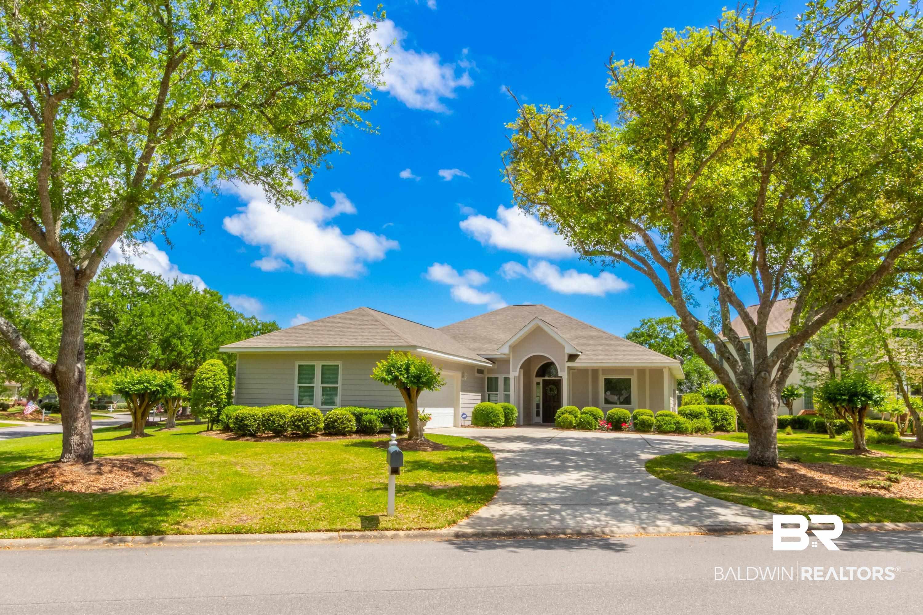 Image 3: Ranch-style home featuring a front yard, driveway, an attached garage, and a shingled roof