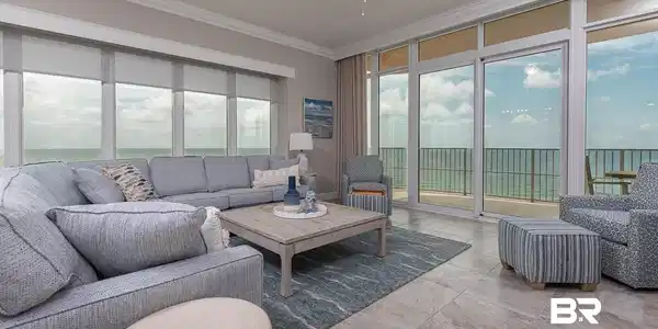 Image 2: Living room with ceiling fan, plenty of natural light, and crown molding