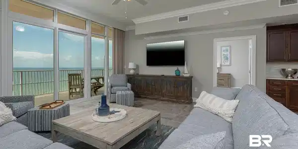 Image 3: Living room with ceiling fan and crown molding