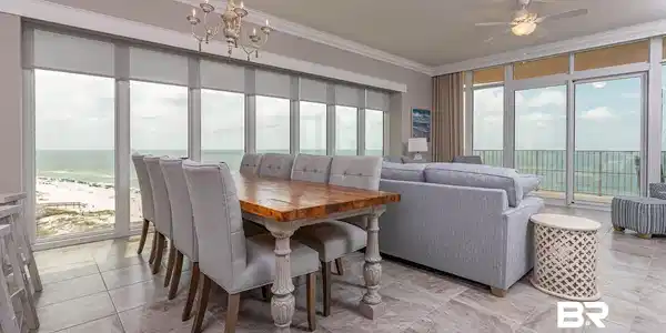 Image 4: Dining room with ceiling fan with notable chandelier, a water view, and crown molding